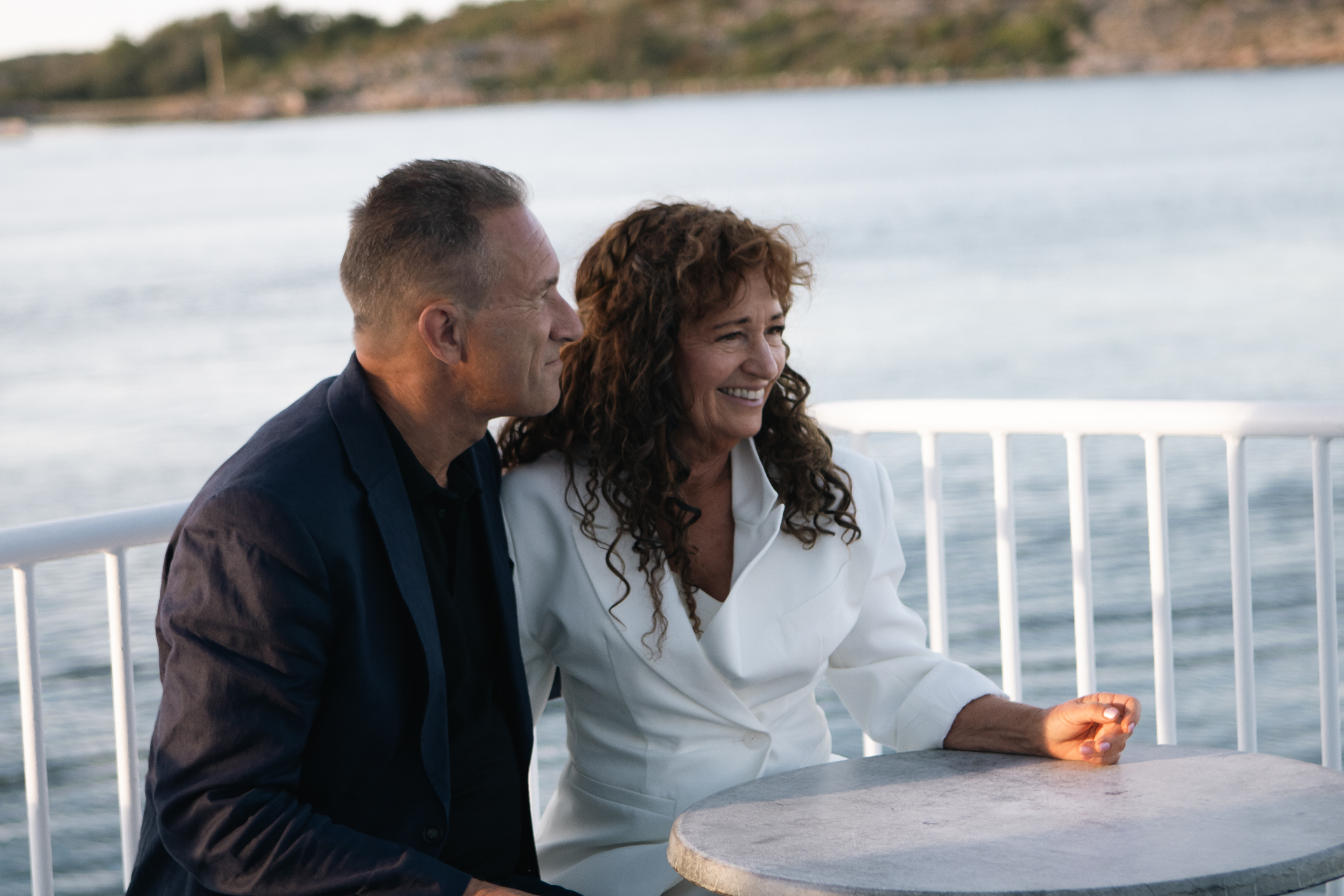 Kerstin and Thim Öhman by the water at golden hour